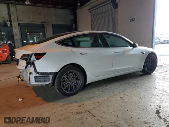 ✅ 2020 Tesla Model 3 Long Range • VIN: 5YJ3E1EB0LF619024 • Лот: 84633295. Опубликован ранее на Copart с пробегом 99 802 миль. Бесплатный доступ к архиву аукционных продаж из США и подробный отчёт об истории автомобиля на DreamBid. Изображение 3.