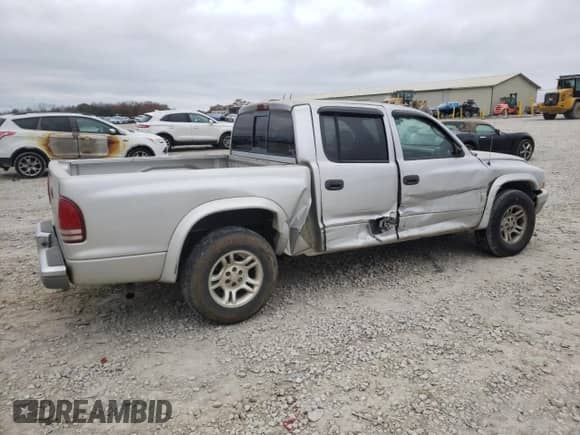 2003 Dodge Dakota SLT z VIN 1D7HL48X13S151334, wystawiony jako Copart lot #82016764 z przebiegiem 216 281 mil mil oraz Szkoda całkowita • Salvage title. Historia ofert i sprzedaży dostępna na DreamBid. Obrazek 3.