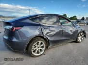 ✅ 2023 Tesla Model Y Long Range • VIN: 7SAYGDEE3PF714262 • Lot: 71861085. Listed on Copart with 13,670 mi. Free auction sales archive from the USA and detailed vehicle history report at DreamBid. Image 3.