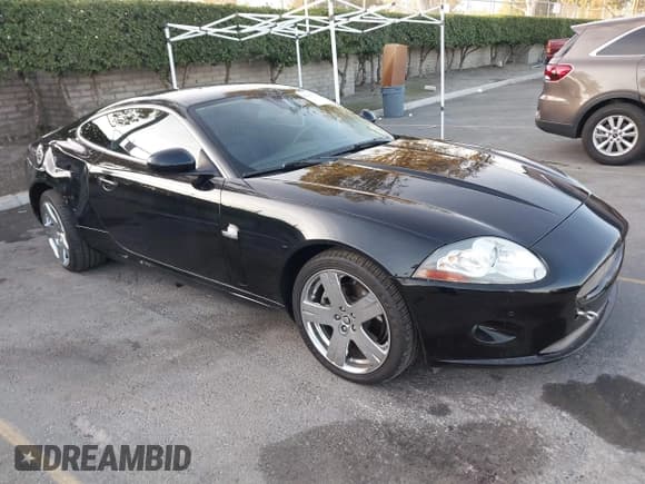 ✅ 2008 Jaguar XK • VIN: SAJWA43B985B23987 • Lot: 41197091. Listed on IAAI with 54,803 mi. Free auction sales archive from the USA and detailed vehicle history report at DreamBid. Image 1.