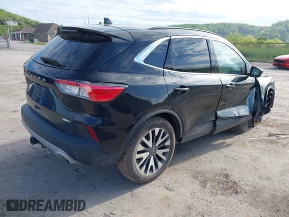 ✅ 2020 Ford Escape Titanium • VIN: 1FMCU9J96LUA72557 • Lot: 42204154. Listed on IAAI with 100 mi. Free auction sales archive from the USA and detailed vehicle history report at DreamBid. Image 4.