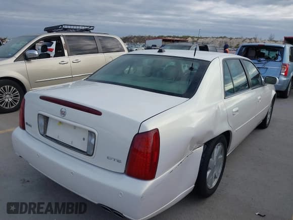 ✅ 2004 Cadillac DeVille DTS • VIN: 1G6KF579X4U238691 • Lot: 41367367. Listed on IAAI with 69,902 mi. Free auction sales archive from the USA and detailed vehicle history report at DreamBid. Image 4.