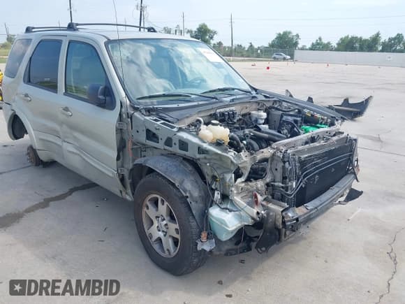 ✅ 2005 Ford Escape Limited • VIN: 1FMYU04115KC73630 • Lot: 43260981. Listed on IAAI with 128,847 mi. Free auction sales archive from the USA and detailed vehicle history report at DreamBid. Image 1.