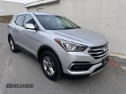 ✅ 2018 Hyundai Santa Fe 2.4L • VIN: 5XYZT3LB6JG565927 • Лот: 92522215. Опубликован ранее на Copart с пробегом 116 009 миль. Бесплатный доступ к архиву аукционных продаж из США и подробный отчёт об истории автомобиля на DreamBid. Изображение 1.