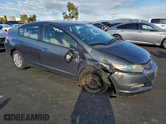 ✅ 2010 Honda Insight LX • VIN: JHMZE2H50AS019754 • Lot: 95014295. Listed on Copart with 120,612 mi. Free auction sales archive from the USA and detailed vehicle history report at DreamBid. Image 4.