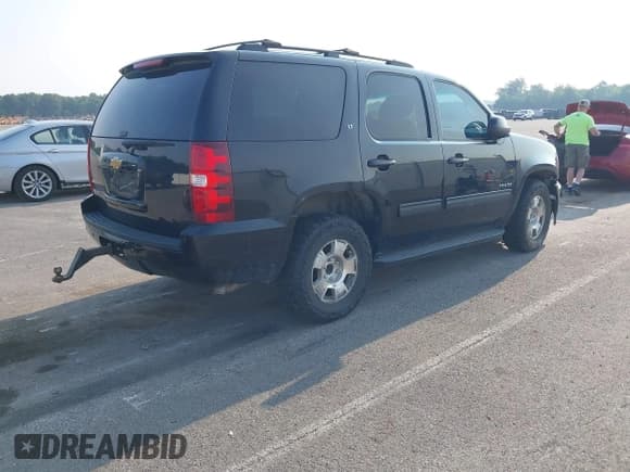 ✅ 2014 Chevrolet Tahoe LT • VIN: 1GNSCBE01ER235571 • Lot: 42403118. Listed on IAAI with 238,069 mi. Free auction sales archive from the USA and detailed vehicle history report at DreamBid. Image 4.
