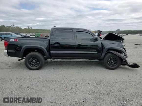 ✅ 2023 Toyota Tacoma SR5 • VIN: 3TYAZ5CN8PT031801 • Lot: 86067835. Listed on Copart with 27,793 mi. Free auction sales archive from the USA and detailed vehicle history report at DreamBid. Image 14.