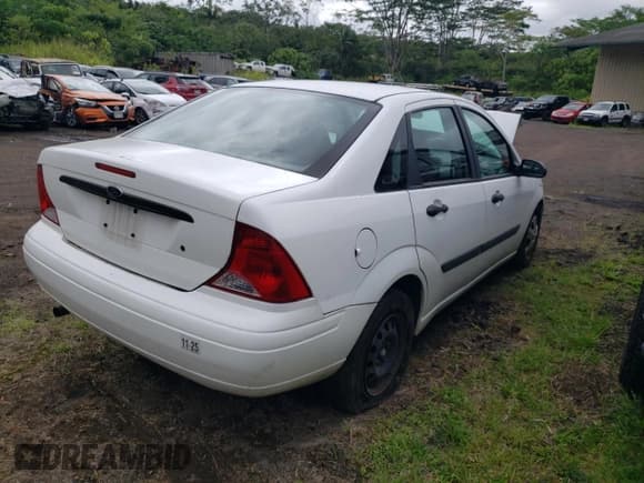 ✅ 2004 Ford Focus LX • VIN: 1FAFP33P74W164340 • Lot: 70513195. Listed on Copart with 186,485 mi. Free auction sales archive from the USA and detailed vehicle history report at DreamBid. Image 3.