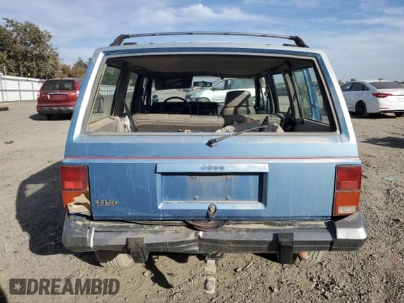 ✅ 1991 Jeep Cherokee • VIN: 1J4FJ58S1ML520376 • Lot: 75452364. Listed on Copart with 147,982 mi. Free auction sales archive from the USA and detailed vehicle history report at DreamBid. Image 6.