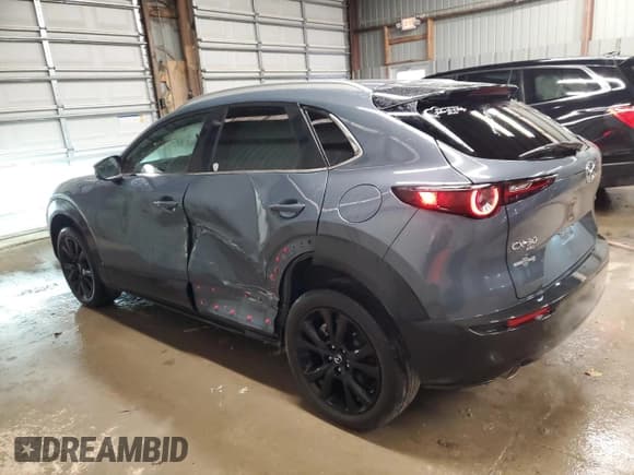 ✅ 2023 Mazda CX-30 S Carbon Edition • VIN: 3MVDMBCMXPM586597 • Lot: 92169615. Listed on Copart with 26,327 mi. Free auction sales archive from the USA and detailed vehicle history report at DreamBid. Image 2.