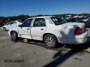 ✅ 2003 Ford Crown Victoria LX • VIN: 2FAFP74W93X182581 • Lot: 86673825. Listed on Copart with 254,616 mi. Free auction sales archive from the USA and detailed vehicle history report at DreamBid. Image 2.