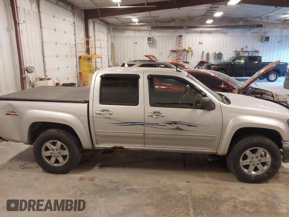 ✅ 2011 GMC Canyon SLT • VIN: 1GTH6NFE2B8131890 • Lot: 43561431. Listed on IAAI with 114,728 mi. Free auction sales archive from the USA and detailed vehicle history report at DreamBid. Image 13.