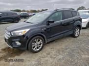 ✅ 2018 Ford Escape SE • VIN: 1FMCU0GD0JUC36969 • Lot: 94981265. Listed on Copart with 127,764 mi. Free auction sales archive from the USA and detailed vehicle history report at DreamBid. Image 1.