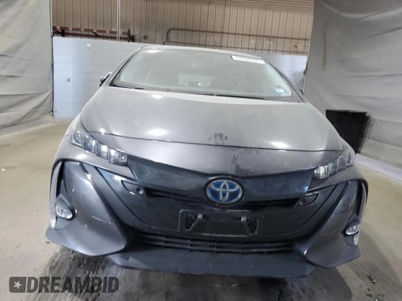 ✅ 2021 Toyota Prius LE • VIN: JTDKAMFPXM3176253 • Lot: 82098695. Listed on Copart with 64,523 mi. Free auction sales archive from the USA and detailed vehicle history report at DreamBid. Image 5.