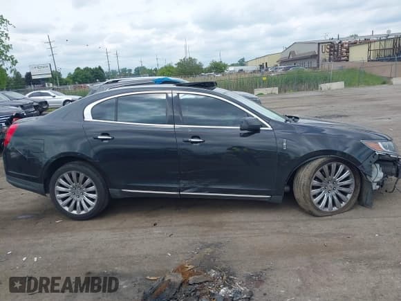 ✅ 2014 Lincoln MKS • VIN: 1LNHL9EKXEG612063 • Lot: 42347630. Listed on IAAI with 106,643 mi. Free auction sales archive from the USA and detailed vehicle history report at DreamBid. Image 14.
