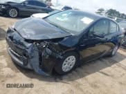 ✅ 2022 Toyota Prius L Eco • VIN: JTDKAMFU8N3181135 • Lot: 42098611. Listed on IAAI with 69,949 mi. Free auction sales archive from the USA and detailed vehicle history report at DreamBid. Image 2.