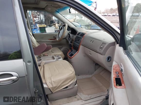 ✅ 2004 Kia Sedona LX • VIN: KNDUP131746590966 • Лот: 43710097. Опубликован ранее на IAAI с пробегом 183 936 миль. Бесплатный доступ к архиву аукционных продаж из США и подробный отчёт об истории автомобиля на DreamBid. Изображение 5.