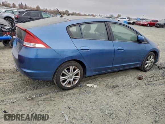 ✅ 2010 Honda Insight LX • VIN: JHMZE2H55AS003503 • Лот: 93785475. Опубликован ранее на Copart с пробегом 185 984 миль. Бесплатный доступ к архиву аукционных продаж из США и подробный отчёт об истории автомобиля на DreamBid. Изображение 3.