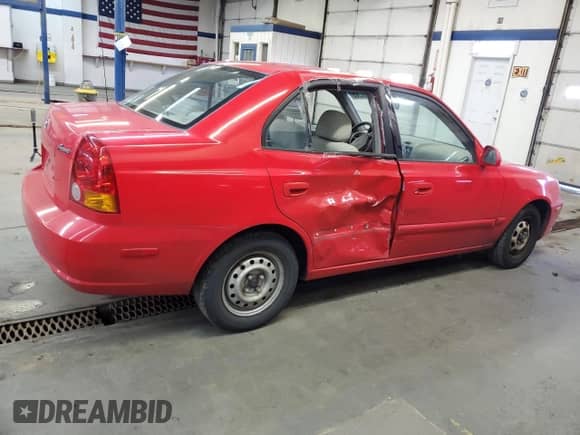 2004 Hyundai Accent GL z VIN KMHCG45C94U538368, wystawiony jako Copart lot #42444565 z przebiegiem 163 028 mil mil oraz Szkoda całkowita • Salvage title. Historia ofert i sprzedaży dostępna na DreamBid. Obrazek 3.