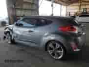 2015 Hyundai Veloster z VIN KMHTC6AD1FU232550, wystawiony jako Copart lot #69808314 z przebiegiem 97 915 mil mil oraz Szkoda całkowita • Salvage title. Historia ofert i sprzedaży dostępna na DreamBid. Obrazek 2.