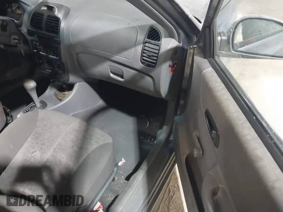 2004 Hyundai Accent GL z VIN KMHCG45C44U528783, wystawiony jako IAAI lot #41535104 z przebiegiem Nie podano mil oraz . Historia ofert i sprzedaży dostępna na DreamBid. Obrazek 5.