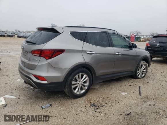 ✅ 2018 Hyundai Santa Fe 2.0T • VIN: 5XYZU4LA4JG536212 • Лот: 39029963. Опубликован ранее на Copart с пробегом 74 993 миль. Бесплатный доступ к архиву аукционных продаж из США и подробный отчёт об истории автомобиля на DreamBid. Изображение 3.