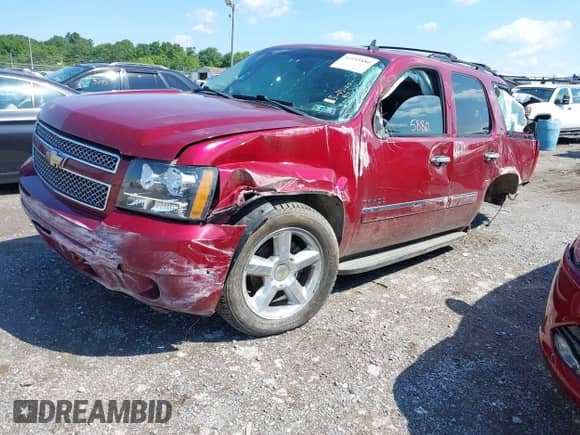 2011 Chevrolet Tahoe LTZ with VIN 1GNSKCE0XBR158736, listed as a IAAI auction lot 42355880 with 288,518 mi miles and . Bid and sale history available at DreamBid. Image 2.