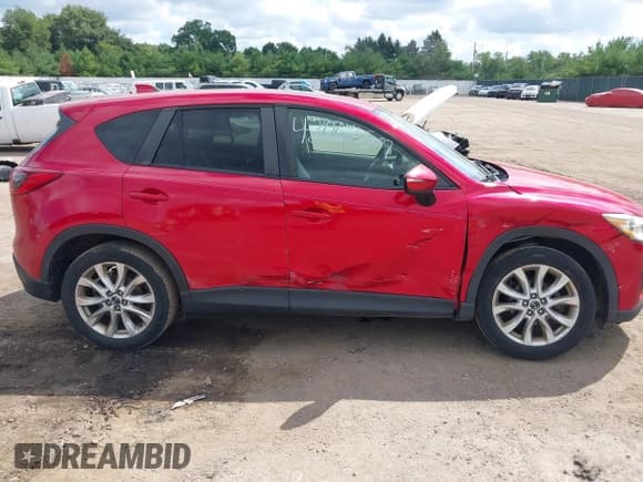 ✅ 2015 Mazda CX-5 Grand Touring • VIN: JM3KE4DY6F0507812 • Lot: 43062570. Listed on IAAI with 251,158 mi. Free auction sales archive from the USA and detailed vehicle history report at DreamBid. Image 6.