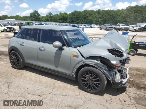 ✅ 2018 MINI Hardtop 4 Door Cooper • VIN: WMWXU1C59J2F79902 • Lot: 60544735. Listed on Copart with 74,057 mi. Free auction sales archive from the USA and detailed vehicle history report at DreamBid. Image 4.