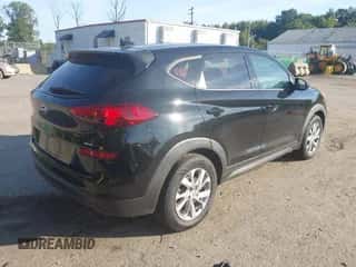 2019 Hyundai Tucson SE with VIN KM8J2CA40KU001142, listed as a IAAI auction lot 43362303 with 70,504 mi miles and . Bid and sale history available at DreamBid. Image 4.