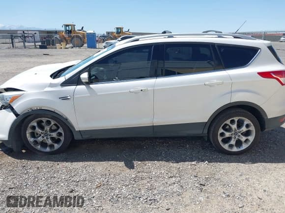 ✅ 2015 Ford Escape Titanium • VIN: 1FMCU0J98FUB63295 • Lot: 42007554. Listed on IAAI with 137,061 mi. Free auction sales archive from the USA and detailed vehicle history report at DreamBid. Image 14.