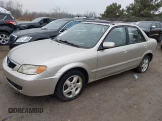 ✅ 2002 Mazda Protege DX • VIN: JM1BJ225121563663 • Lot: 43725847. Wystawiony na IAAI z przebiegiem 120 456 mil. Bezpłatny archiwum sprzedaży aukcyjnych z USA i szczegółowy raport historii pojazdu na DreamBid. Zdjęcie 2.