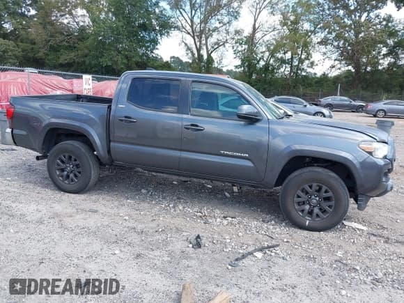 ✅ 2020 Toyota Tacoma SR5 • VIN: 3TMAZ5CN0LM129386 • Lot: 43242623. Listed on IAAI with 35,673 mi. Free auction sales archive from the USA and detailed vehicle history report at DreamBid. Image 13.