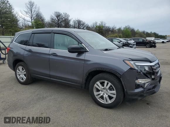 ✅ 2017 Honda Pilot LX • VIN: 5FNYF6H18HB070005 • Lot: 56146665. Listed on Copart with 122,138 mi. Free auction sales archive from the USA and detailed vehicle history report at DreamBid. Image 4.