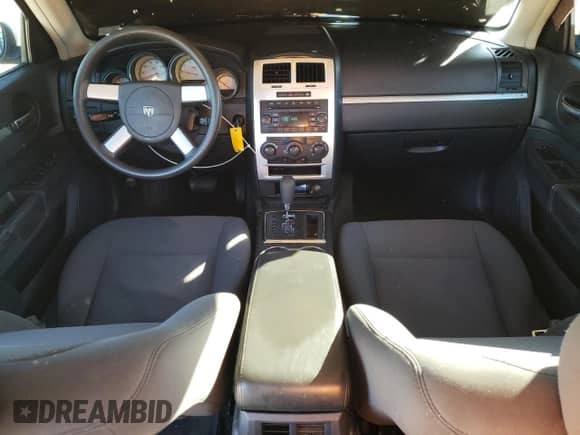 2010 Dodge Charger SXT z VIN 2B3CA3CV7AH285801, wystawiony jako Copart lot #75801874 z przebiegiem 221 337 mil mil oraz Szkoda całkowita • Salvage title. Historia ofert i sprzedaży dostępna na DreamBid. Obrazek 8.