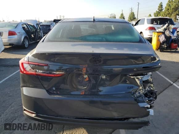 2025 Toyota Camry LE with VIN 4T1DAACK8SU067003, listed as a Copart auction lot 84061975 with 9,394 mi miles and Salvage title. Bid and sale history available at DreamBid. Image 6.