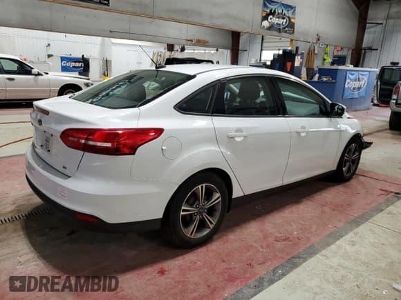 ✅ 2018 Ford Focus SE • VIN: 1FADP3F26JL267575 • Lot: 91492855. Listed on Copart with 79,415 mi. Free auction sales archive from the USA and detailed vehicle history report at DreamBid. Image 3.