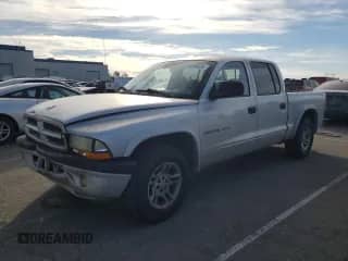 2002 Dodge Dakota Sport с VIN 1B7HL38N72S525267, выставлен на аукционе Copart как лот 43266835 с пробегом 249 502 миль миль и Списание • Salvage title. История ставок и продаж доступна на DreamBid. Изображение 1.