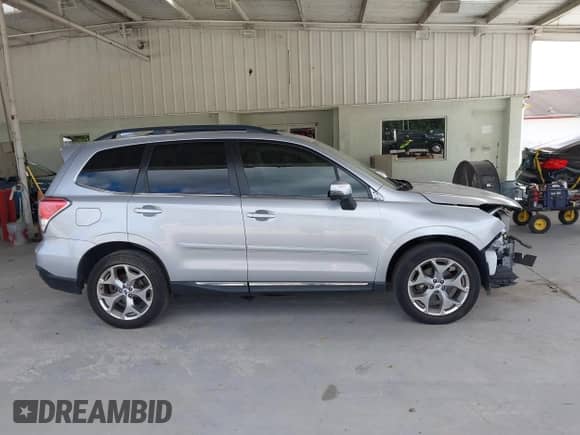 2017 Subaru Forester Touring z VIN JF2SJAWC7HH555670, wystawiony jako IAAI lot #43471642 z przebiegiem 89 476 mil mil oraz . Historia ofert i sprzedaży dostępna na DreamBid. Obrazek 14.