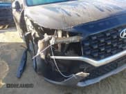 ✅ 2023 Hyundai Santa Fe SE • VIN: 5NMS14AJ4PH552583 • Lot: 43467765. Listed on IAAI with 87,951 mi. Free auction sales archive from the USA and detailed vehicle history report at DreamBid. Image 17.