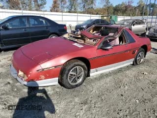 ✅ 1986 Pontiac Fiero • VIN: 1G2PF3794GP243268 • Lot: 77030964. Wystawiony na Copart z przebiegiem 229 244 mil. Bezpłatny archiwum sprzedaży aukcyjnych z USA i szczegółowy raport historii pojazdu na DreamBid. Zdjęcie 1.