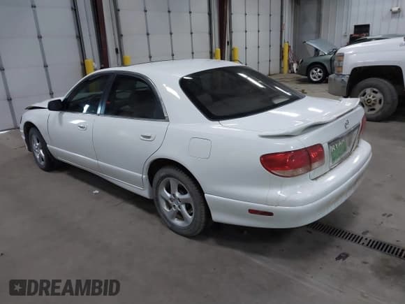 ✅ 2002 Mazda Millenia • VIN: JM1TA221121726040 • Lot: 40649629. Wystawiony na IAAI z przebiegiem 106 024 mil. Bezpłatny archiwum sprzedaży aukcyjnych z USA i szczegółowy raport historii pojazdu na DreamBid. Zdjęcie 3.