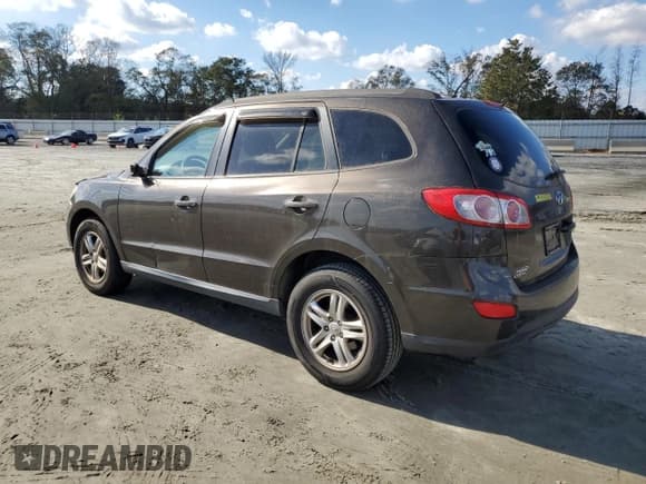 ✅ 2011 Hyundai Santa Fe GLS • VIN: 5XYZGDAG0BG012202 • Lot: 76364974. Listed on Copart with 108,287 mi. Free auction sales archive from the USA and detailed vehicle history report at DreamBid. Image 2.