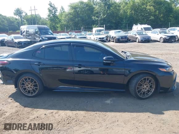 2023 Toyota Camry SE with VIN 4T1G11BKXPU097643, listed as a IAAI auction lot 42833306 with 23,580 mi miles and . Bid and sale history available at DreamBid. Image 13.