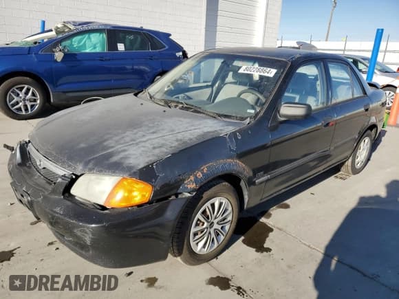 ✅ 2000 Mazda Protege DX • VIN: JM1BJ2220Y0239835 • Lot: 80228864. Wystawiony na Copart z przebiegiem 200 936 mil. Bezpłatny archiwum sprzedaży aukcyjnych z USA i szczegółowy raport historii pojazdu na DreamBid. Zdjęcie 1.