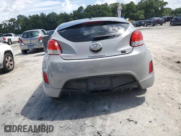 2013 Hyundai Veloster w/Gray Int z VIN KMHTC6AD0DU156798, wystawiony jako Copart lot #64678554 z przebiegiem 119 578 mil mil oraz Szkoda całkowita • Salvage title. Historia ofert i sprzedaży dostępna na DreamBid. Obrazek 6.