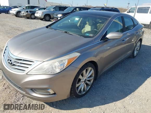 2013 Hyundai Azera with VIN KMHFH4JGXDA303112, listed as a IAAI auction lot 43611021 with 107,219 mi miles and . Bid and sale history available at DreamBid. Image 2.