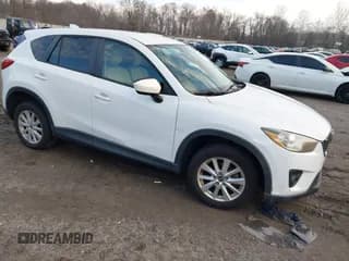 ✅ 2013 Mazda CX-5 Touring • VIN: JM3KE2CEXD0148702 • Lot: 43877352. Listed on IAAI with 183,342 mi. Free auction sales archive from the USA and detailed vehicle history report at DreamBid. Image 1.