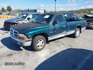 1999 Dodge Dakota SLT z VIN 1B7FL26X6XS267627, wystawiony jako IAAI lot #43548128 z przebiegiem 168 647 mil mil oraz . Historia ofert i sprzedaży dostępna na DreamBid. Obrazek 2.