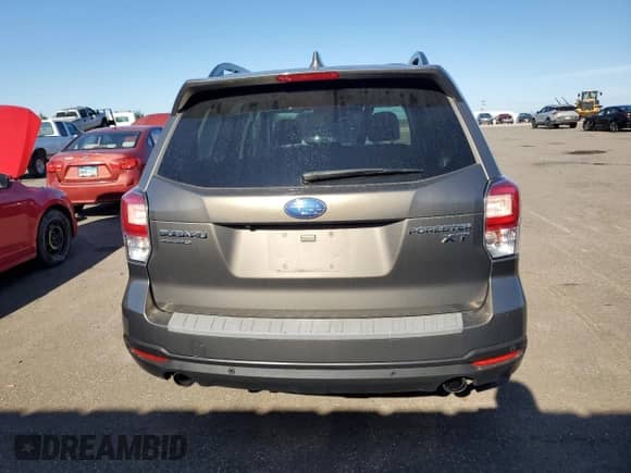 2017 Subaru Forester Touring с VIN JF2SJGWC4HH585860, выставлен на аукционе Copart как лот 85157815 с пробегом 89 784 миль миль и Списание • Salvage title. История ставок и продаж доступна на DreamBid. Изображение 6.